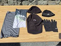 Overview of all six winter accessories laid out on table