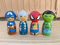 front view of the four superhero bottle figures