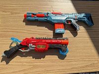 Both blasters side-by-side showing size and colors