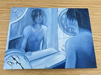 front view of blue monochrome acrylic painting with figure, mirror and clocks