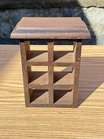 Front view of wooden cubby shelf showing six compartments