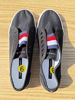 Top view of both sneakers showing uppers and elastic band