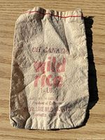 Front view of cotton bag showing red Shoal Lake Wild Rice print