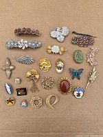 Full layout showing all brooches, pins and hair clips