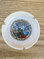 Top view of ceramic ashtray showing full decal and cigarette rests