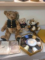 Overall lot: three plush toys, Lexus clock/frame, Royal Collection tea set in box