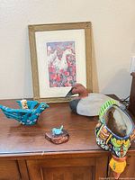 All five items: framed print, wooden decoy, ceramic planter, turquoise candle holder, small blue bird