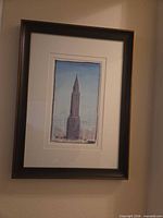 Full view of framed Chrysler Building print on wall