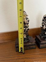 Front view measuring height (~8 in) of one jester bookend