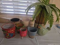 Group shot of all nine planters and vases