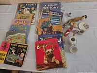 All books and porcelain pieces laid out on table