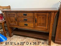 Front view of oak sideboard showing drawers, doors, and dimensions text