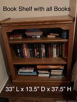Front view of oak bookshelf filled with books