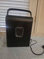 Front view of Pen+Gear shredder showing clear window