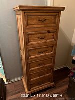 Front view showing six drawers, moulded top and base, metal pulls, dimensions overlay