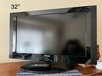 Front view of Samsung 32" TV on stand
