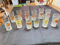 All 12 clear juice glasses arranged on table