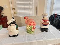Front view of all three ceramic cookie jars with lids