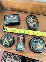 Top view of all five boxes with tape for scale