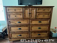 Front view of solid oak dresser showing all drawers and cabinet doors