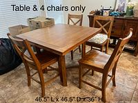 Square solid wood dining table with four matching chairs