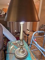 Full view of lamp with shade showing pull chains and overall style