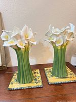 Front view of both calla lily vases on rooster tiles