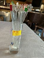 swizzle sticks standing in vase