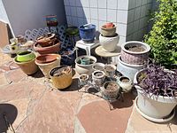 Group shot of assorted pots and stands on patio