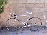 Full view of Bertoni light purple road bike showing frame size, bottle cages, wheels