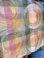 Top view of four ribbed clear glass plates laid out