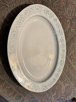 White oval platter with blue floral border