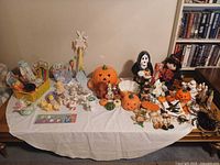 Overall lot on table showing variety of Halloween and fall items