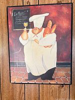 Framed print of chef with baguettes and wine goblet