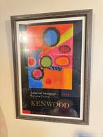 Full view of framed Kenwood Artist Series 1998 wine poster on wall