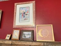 Overall view showing five of the framed pieces on mantel and wall