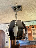 Full view of pendant light hanging from chain