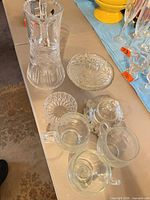 Group shot: pitcher/vase, candy dish components, three mugs, cut bowl