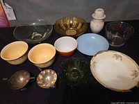 Group shot showing all glass, ceramic and metal pieces in the lot