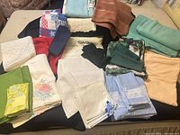 Overall view of assorted folded linens showing colors and variety