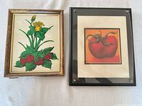 Both framed prints side by side showing artwork and frame styles