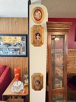 Full view showing all three plaques mounted vertically