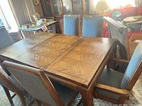 Dining table surrounded by six chairs