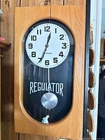 Front view showing entire Seth Thomas wall clock