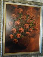 Full view of floral oil painting in frame