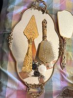 Oval mirrored tray, cake server, hair brush, hand mirror