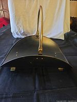 Top view showing coal scuttle profile and brass handle