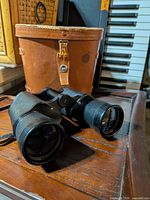 Binoculars resting in front of case