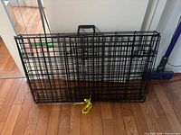 Crate folded flat with carry handle and yellow strap