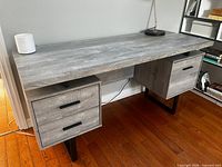 Front angled view showing full desk, top surface, drawer layout and legs